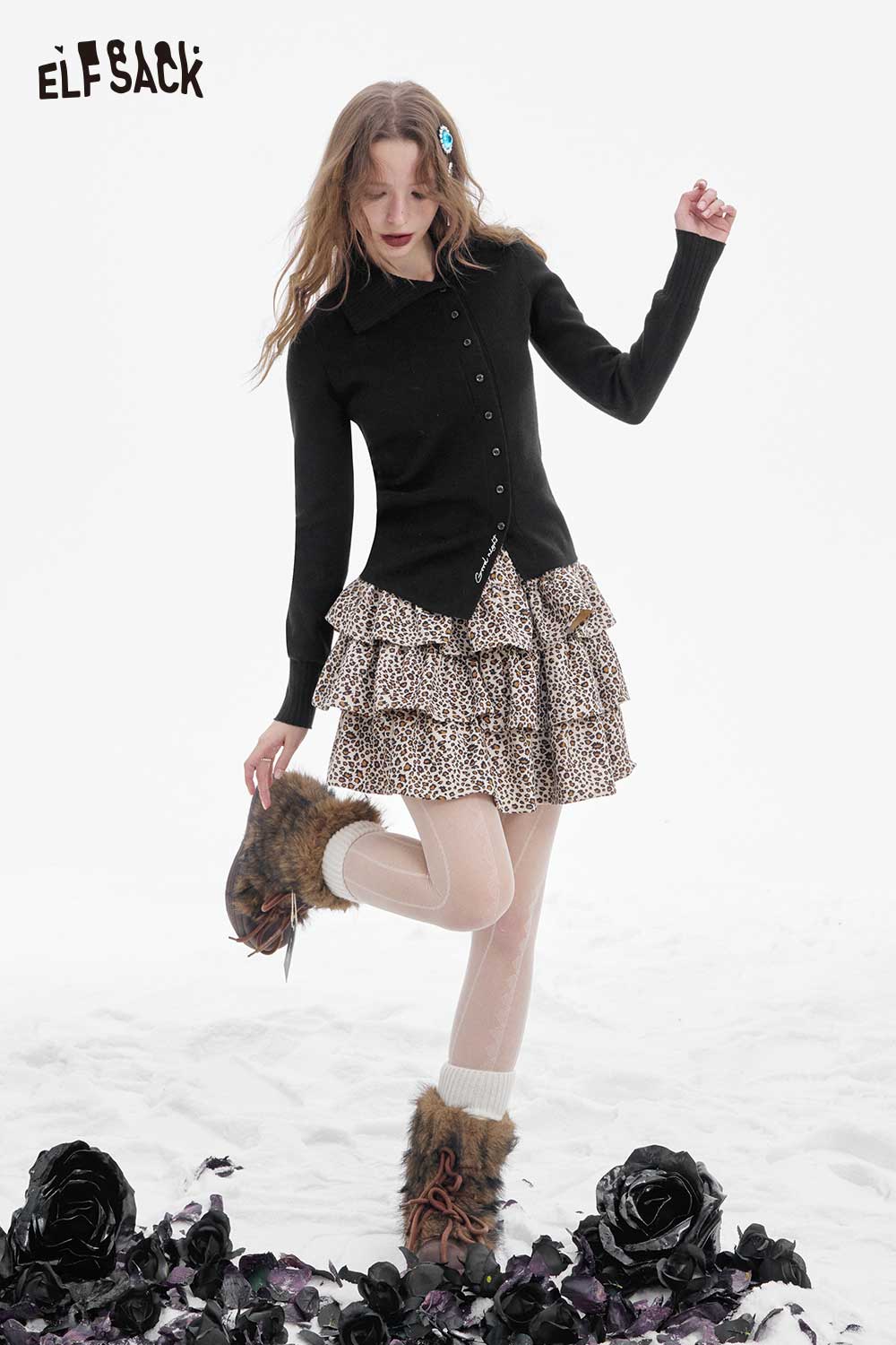 Stylish ELFSACK women's irregular button knit sweater paired with a ruffled skirt for a trendy look