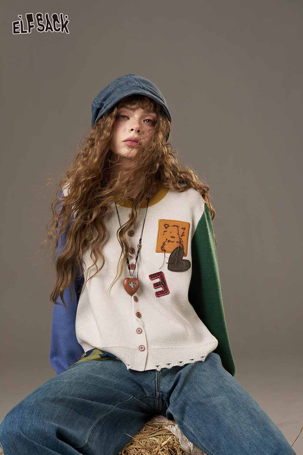 ELFSACK women's knitted jacket with colorful sleeves and unique patch designs for a stylish look