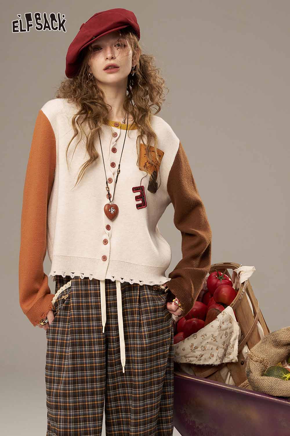 ELFSACK women's knitted jacket in cream and brown with unique buttons and playful details
