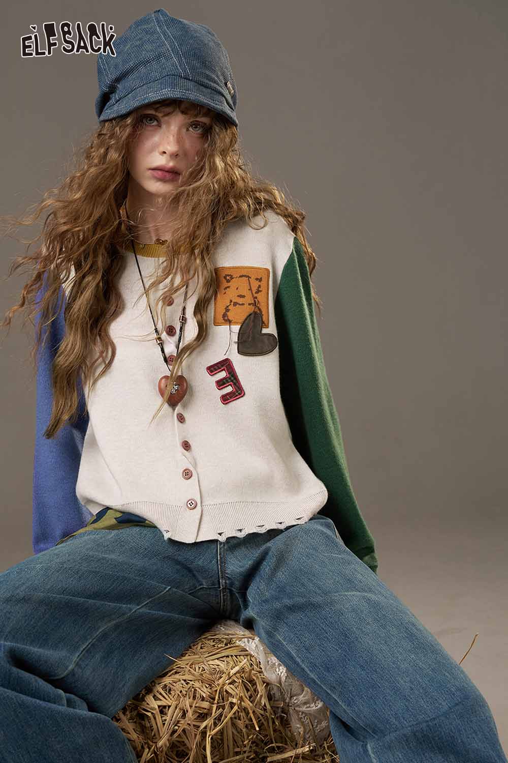 ELFSACK women's knitted jacket with colorful sleeves and playful design for a stylish casual look