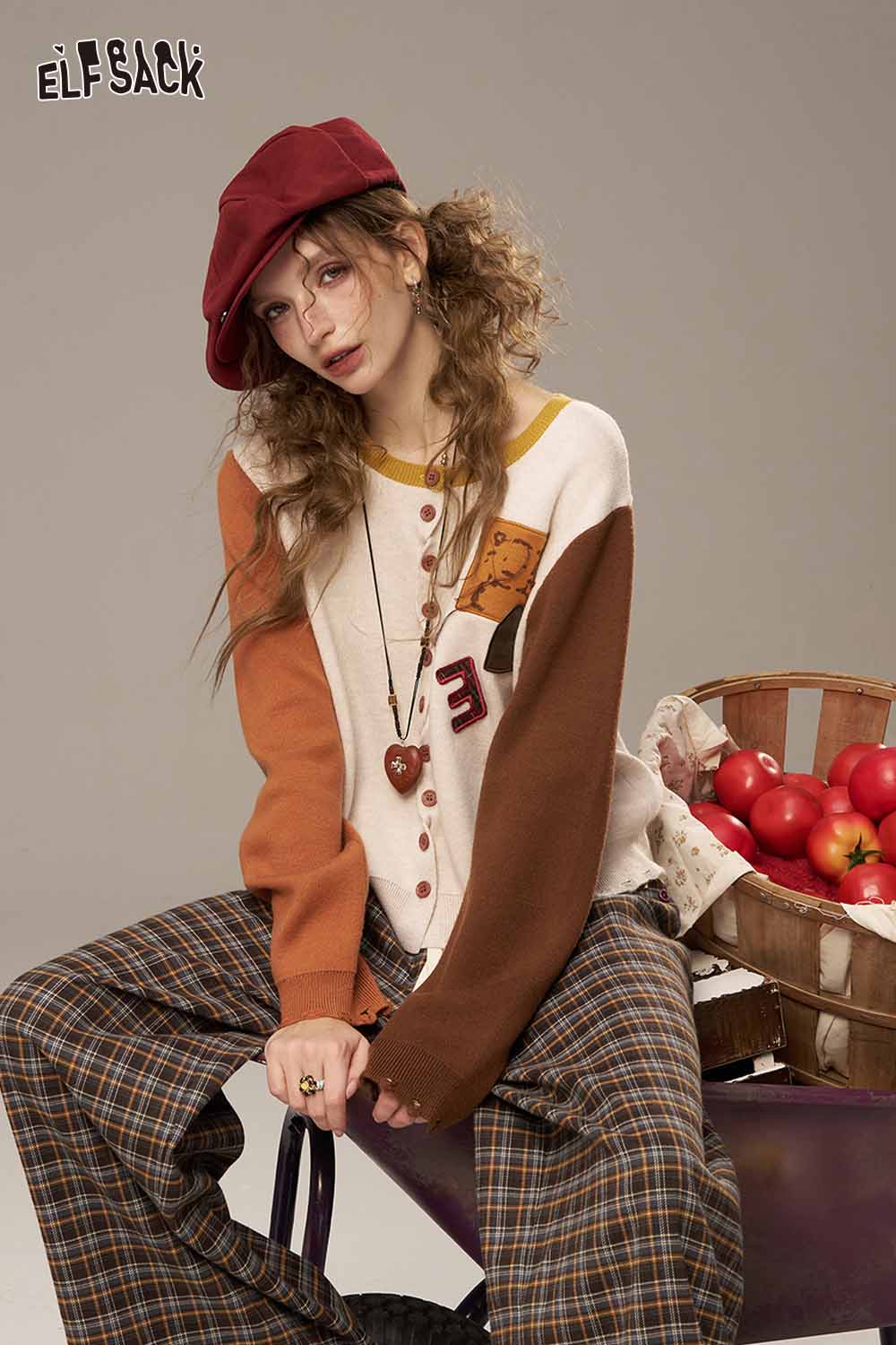 ELFSACK women's knitted jacket featuring a colorful design with buttons and a relaxed fit