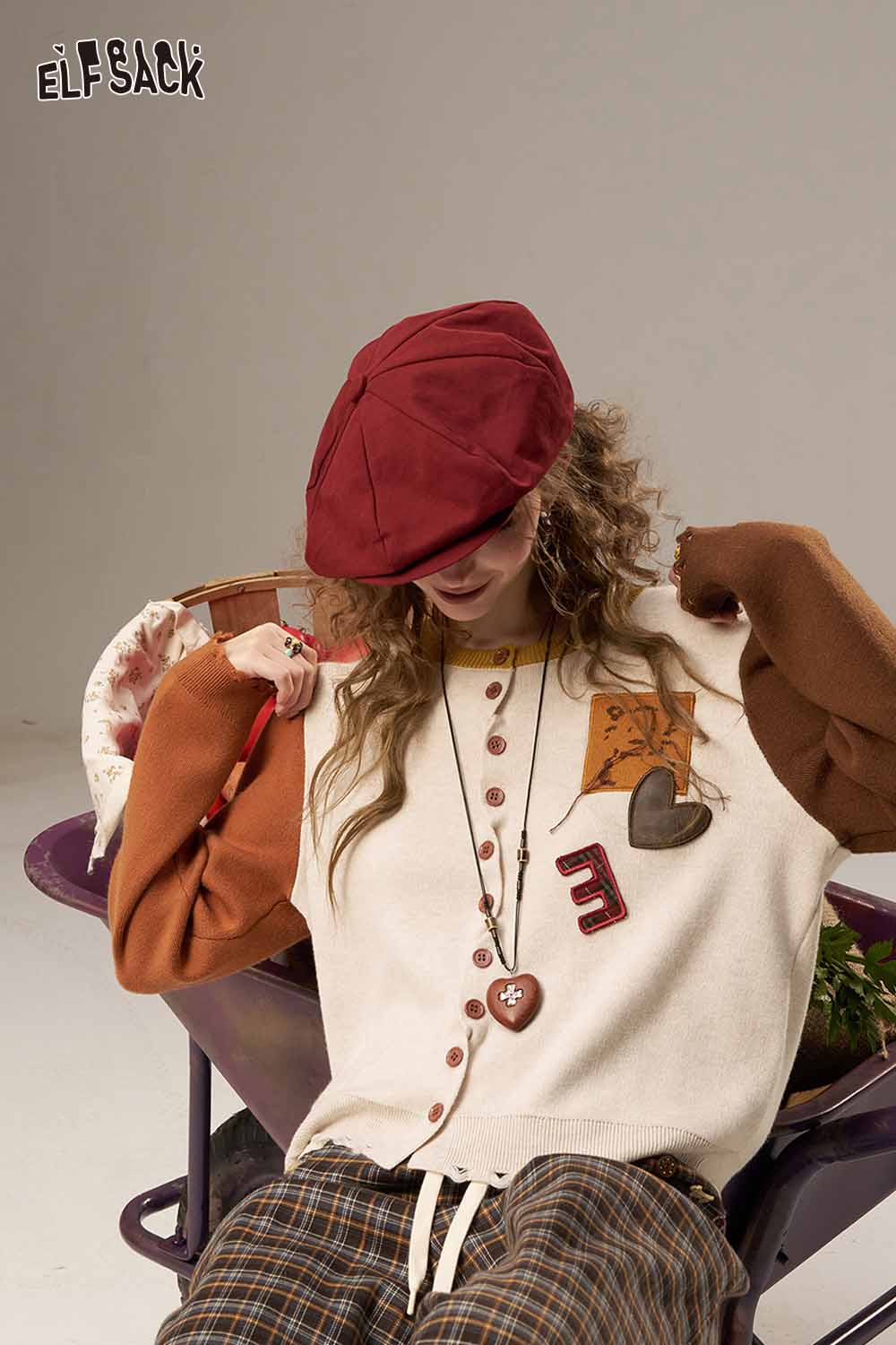 ELFSACK women's knitted jacket with unique patchwork design and button details for a stylish look