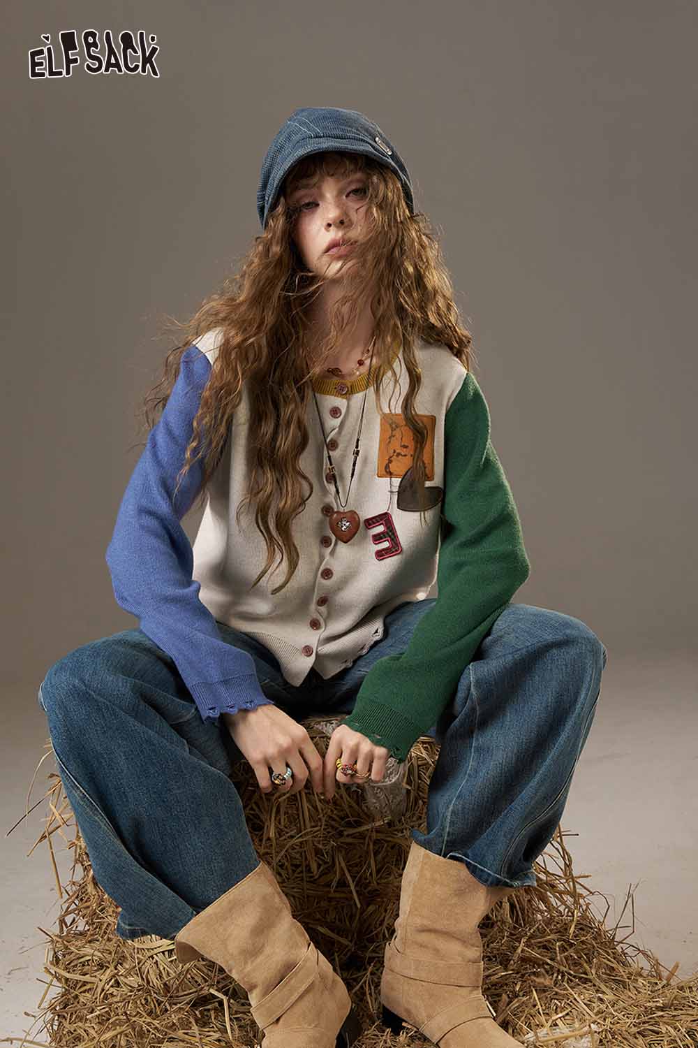ELFSACK women's knitted jacket in colorful design, styled with wide jeans and a denim cap