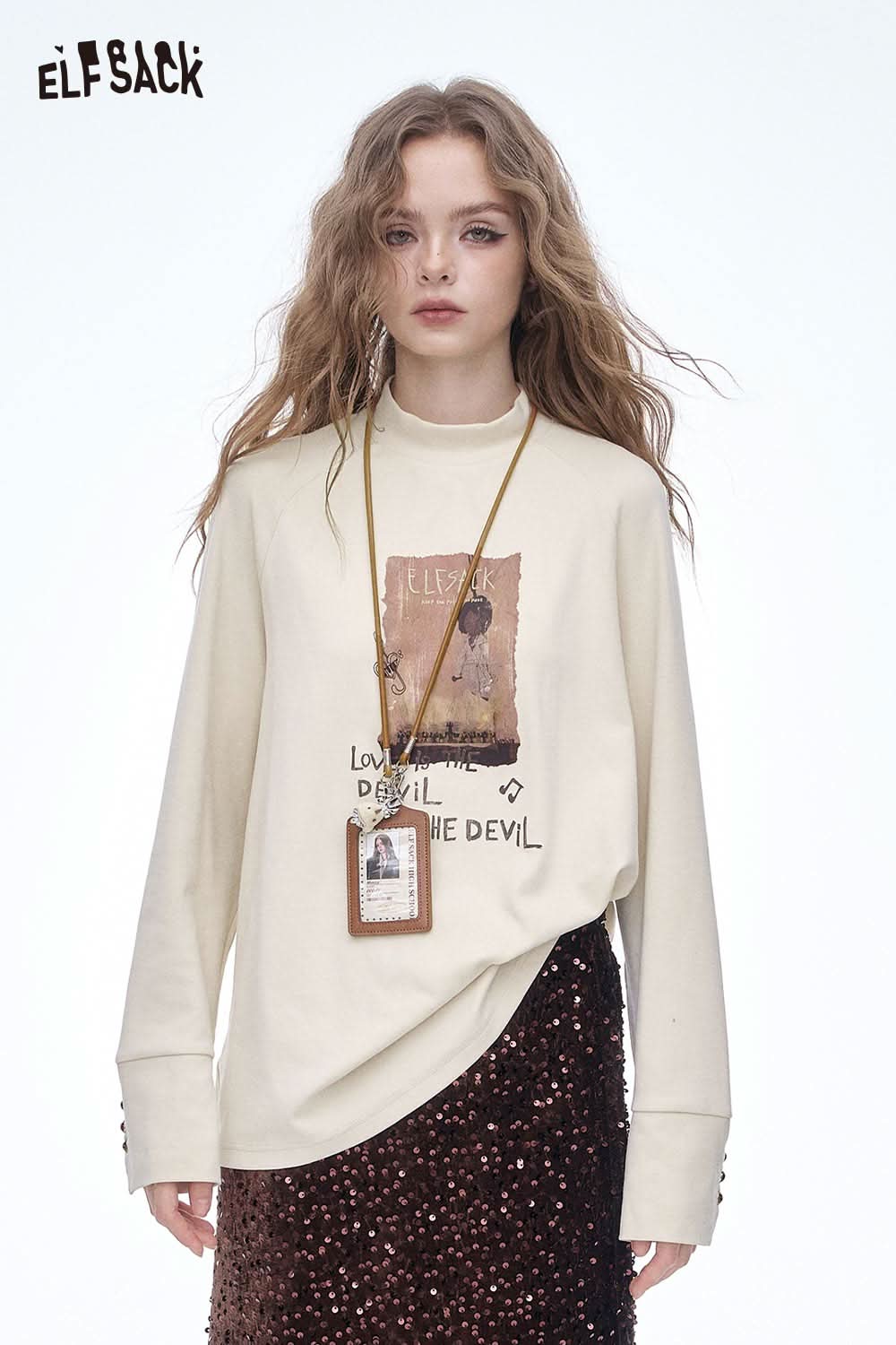 ELFSACK women's letter graphic long sleeve t-shirt in cream with unique artwork for casual style