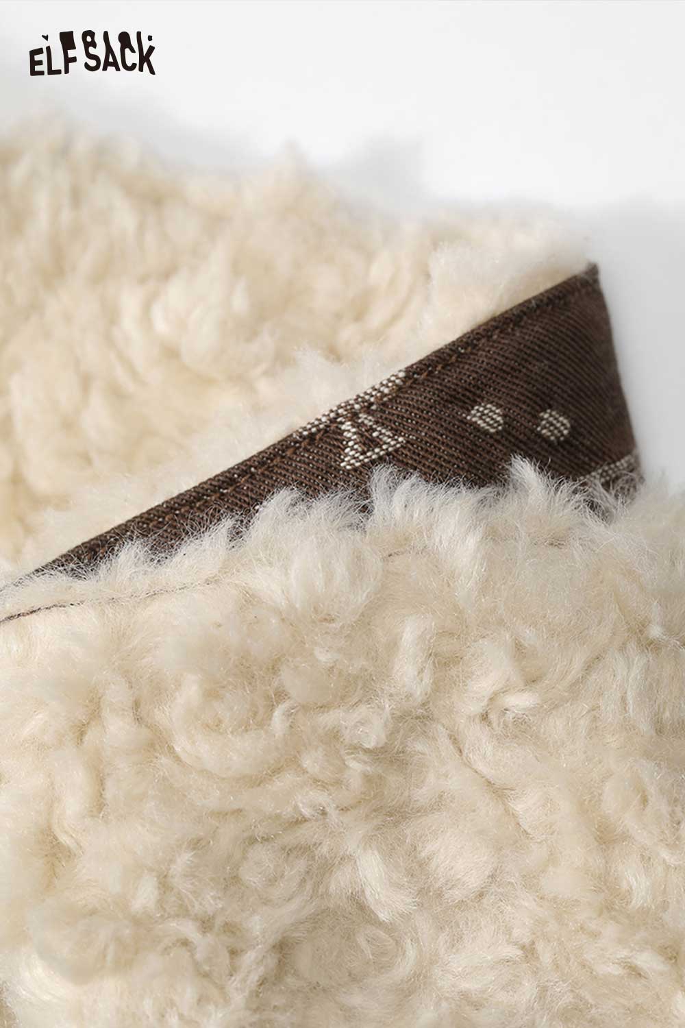 Close-up of ELFSACK women's letter graphic plush coat showcasing soft, fluffy texture and unique design details