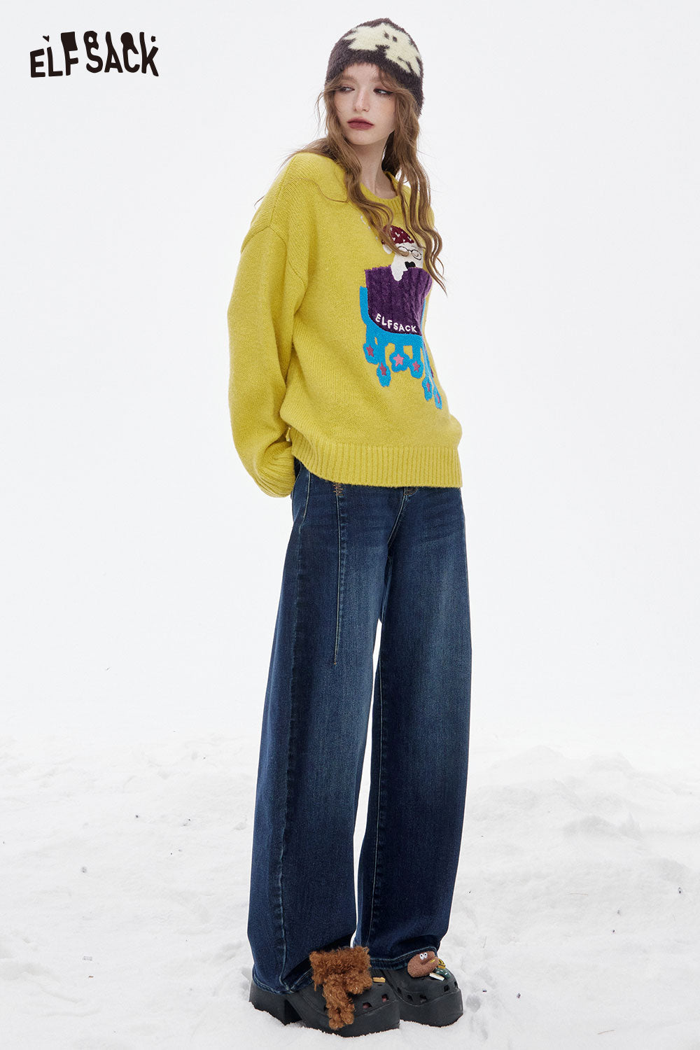 ELFSACK women's loose fit floor length jeans paired with a colorful sweater and stylish accessories