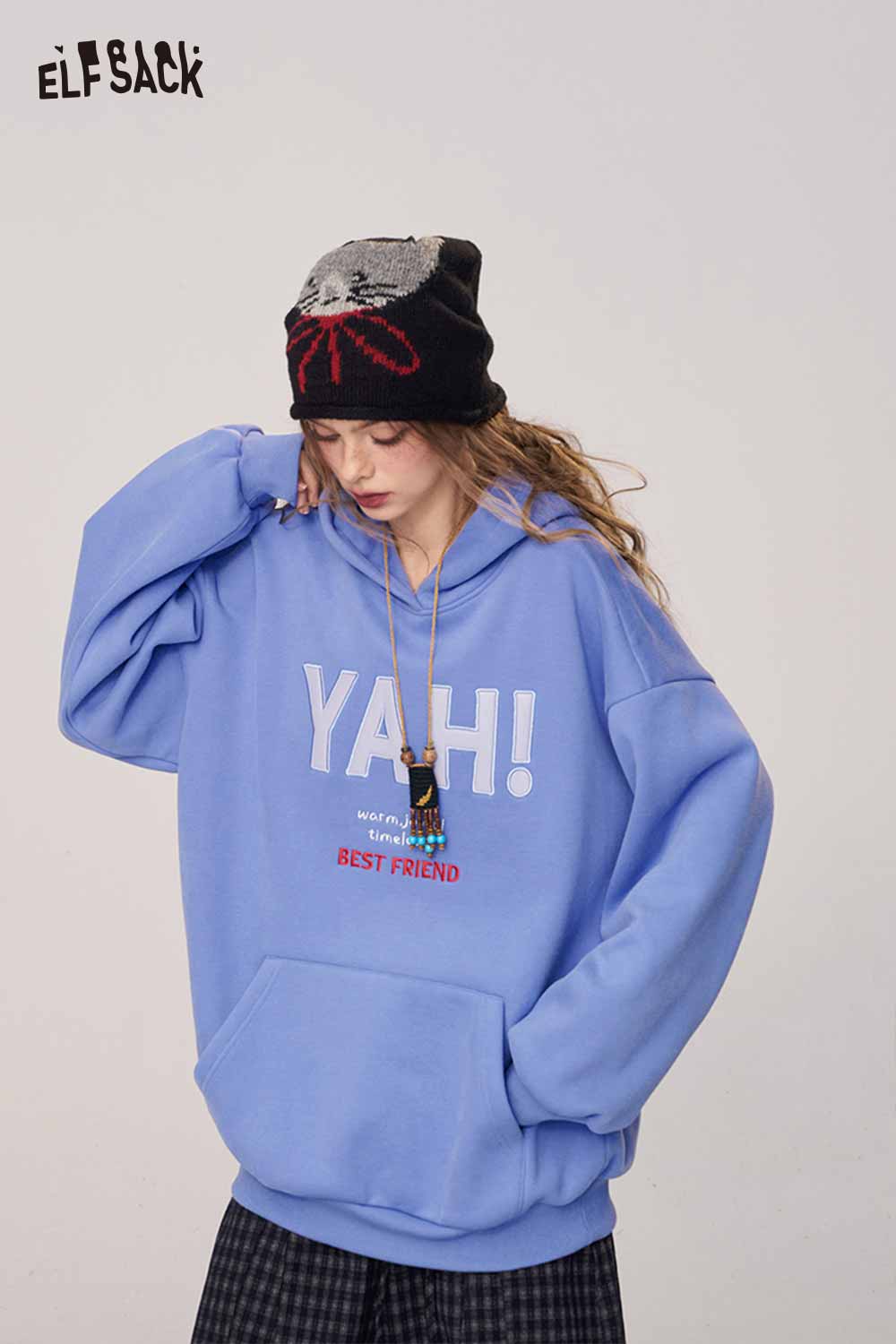 ELFSACK women's loose fit hooded sweatshirt in blue with playful graphic design and front pocket