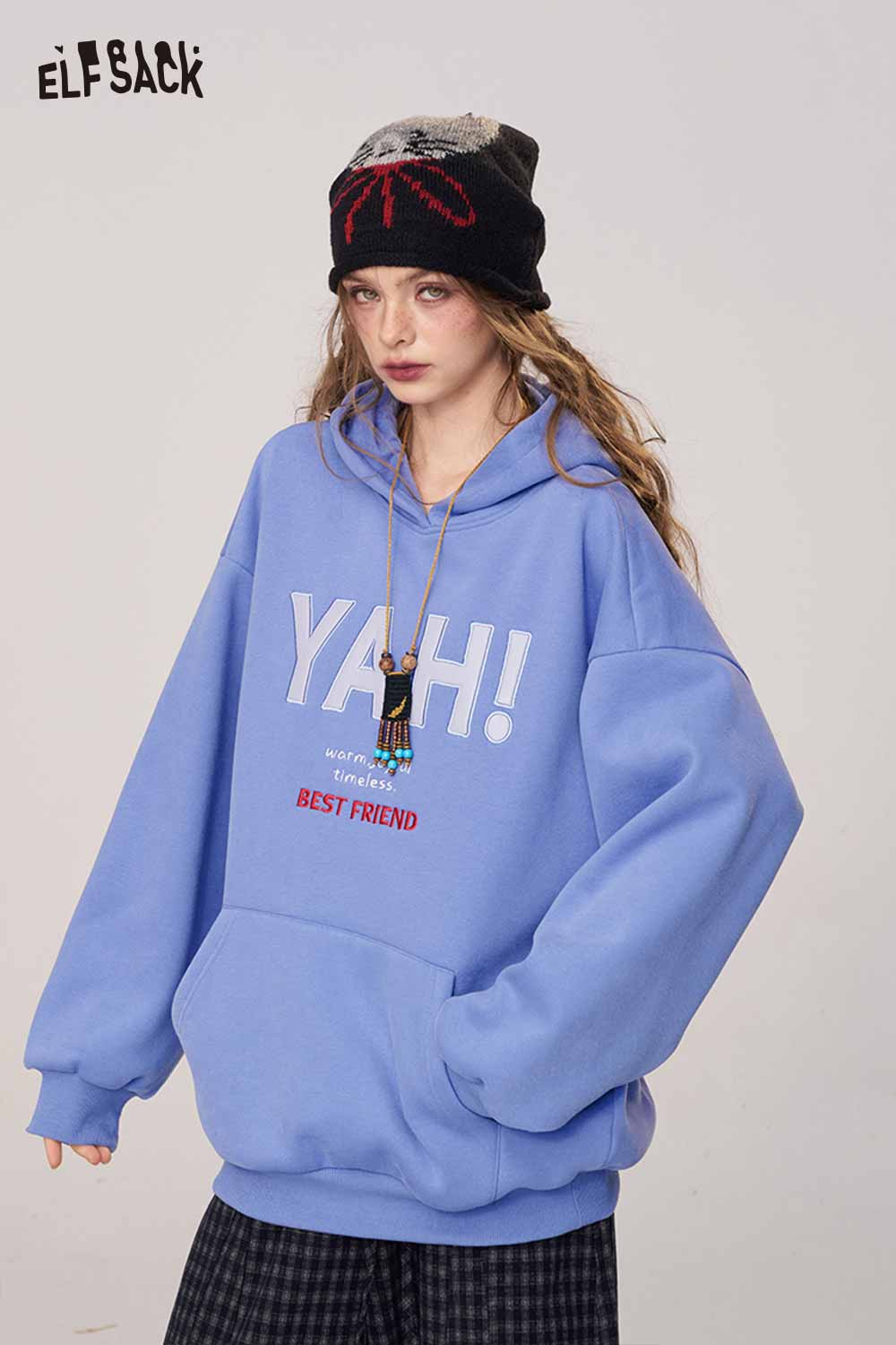 ELFSACK women's loose fit hooded sweatshirt in light blue with playful graphic design