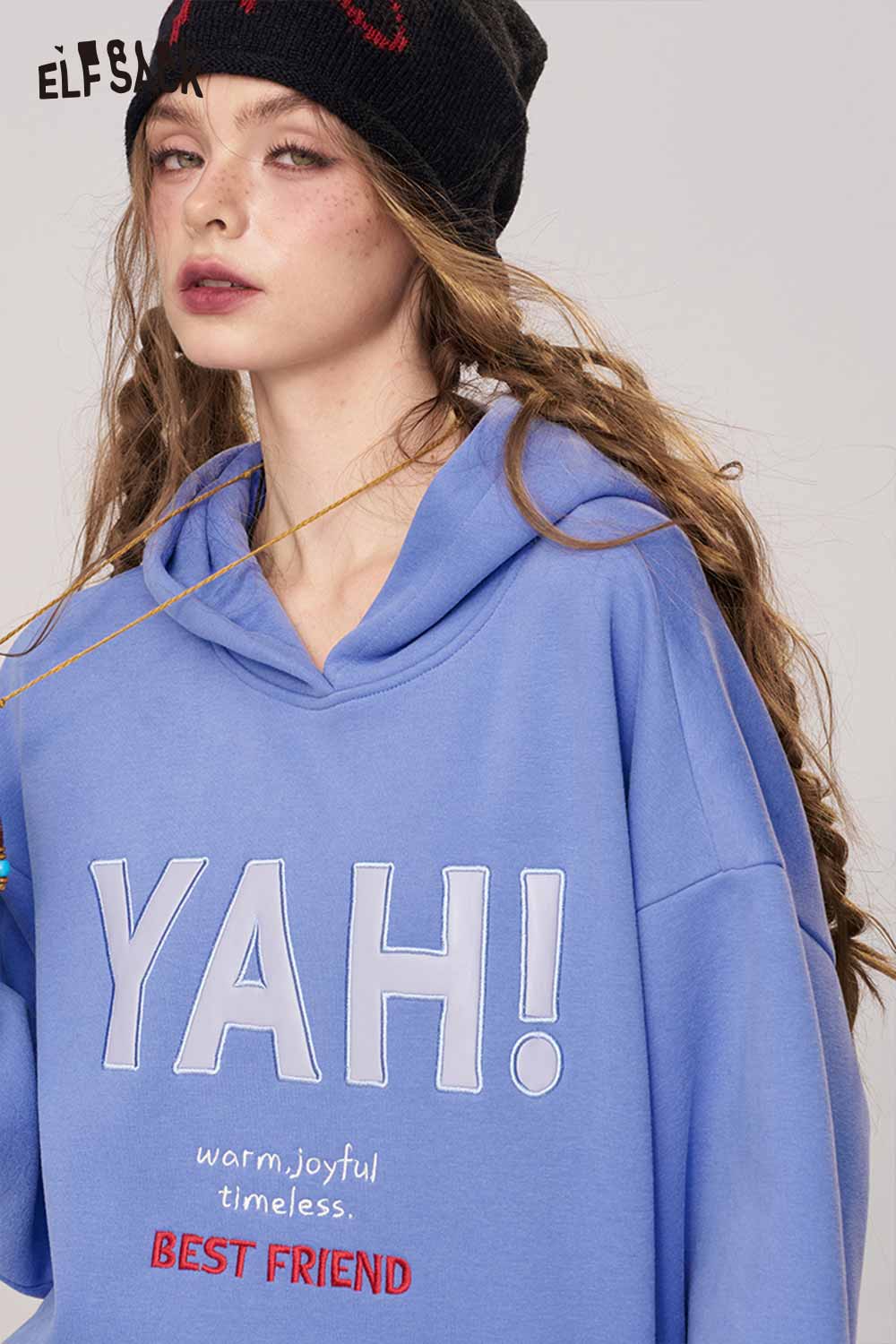 ELFSACK women's loose fit hooded sweatshirt in blue with YAH! graphic and cozy design