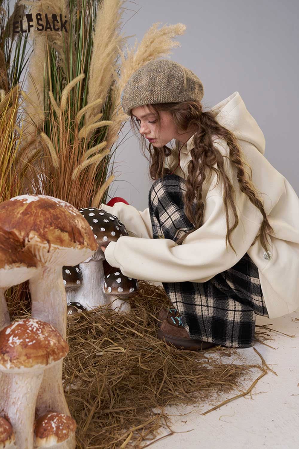 ELFSACK women's loose fit hooded sweatshirt in a cozy setting with natural elements