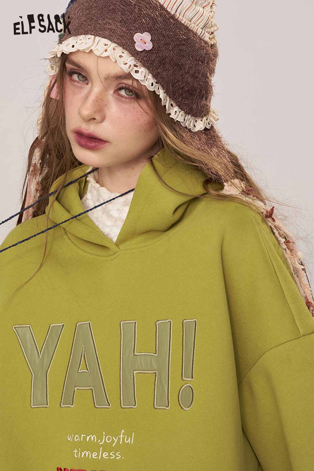 ELFSACK women's loose fit hooded sweatshirt in olive green with graphic print for a stylish casual look