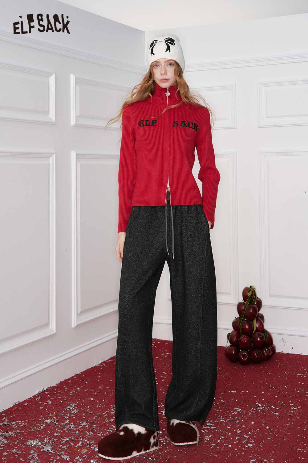 ELFSACK women's loose wide leg pants in black, styled with a red zip-up sweater and winter accessories