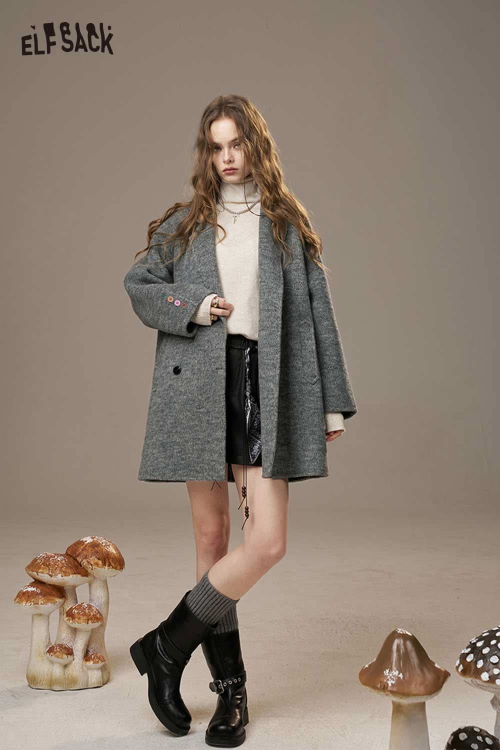 ELFSACK women's oversize wool blend coat in grey, styled with a turtleneck and shorts, set among mushrooms