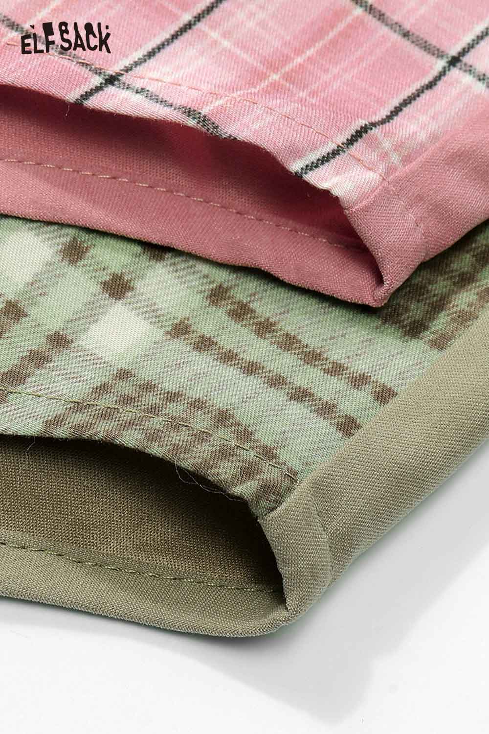 Close-up of ELFSACK women's oversized contrast shirt in pink and green plaid fabric with rolled hem