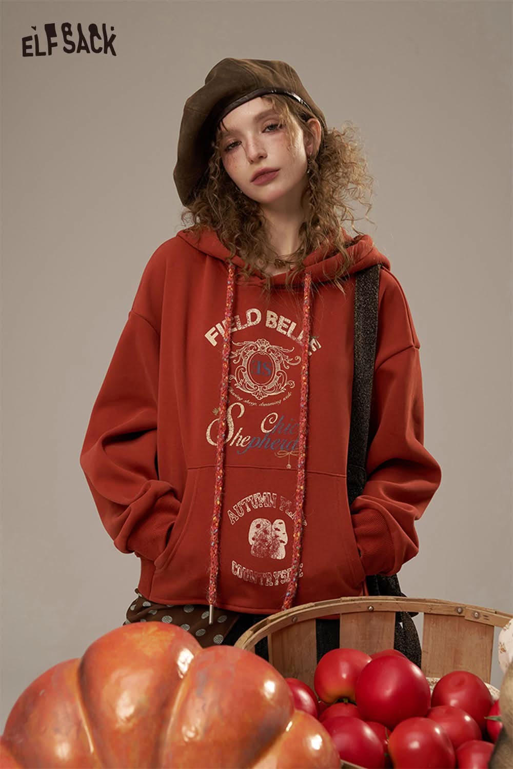 ELFSACK women's oversized print hoodie in rust with graphic design, perfect for casual wear