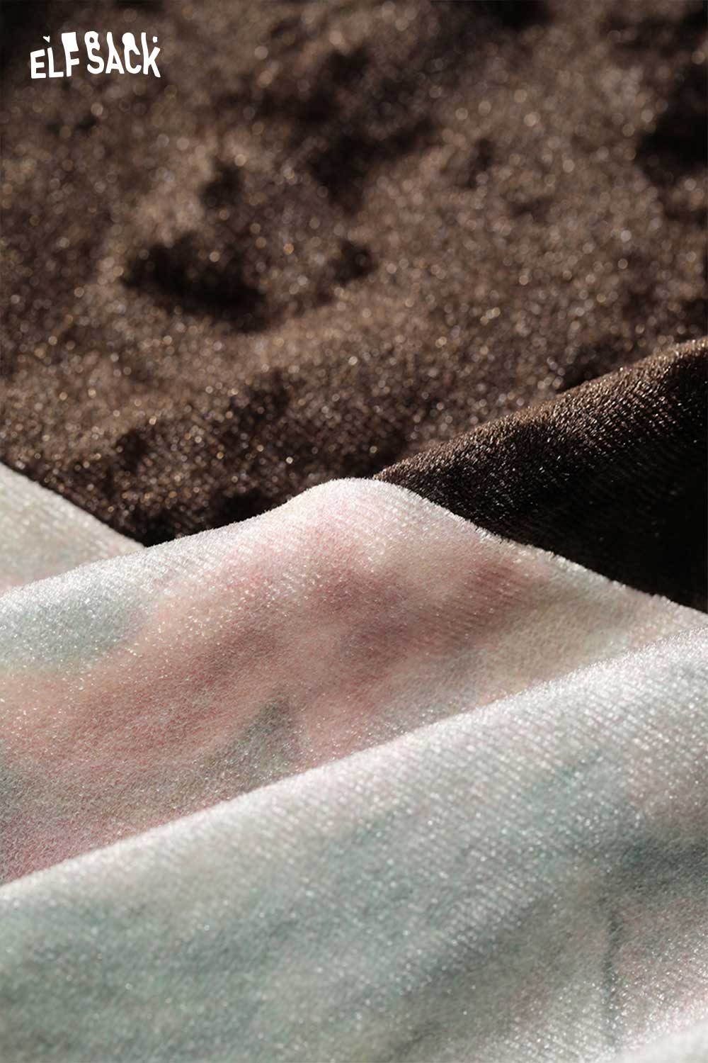 Close-up of ELFSACK women's patchwork long dress showcasing rich fabric textures and colors