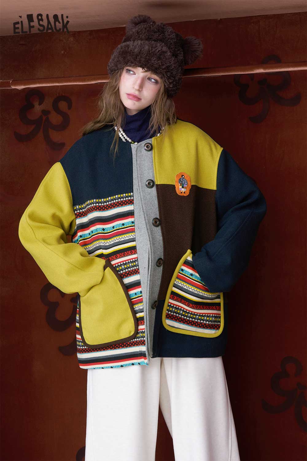 Women's patchwork stripe coat by ELFSACK in vibrant colors with unique patterns and cozy design