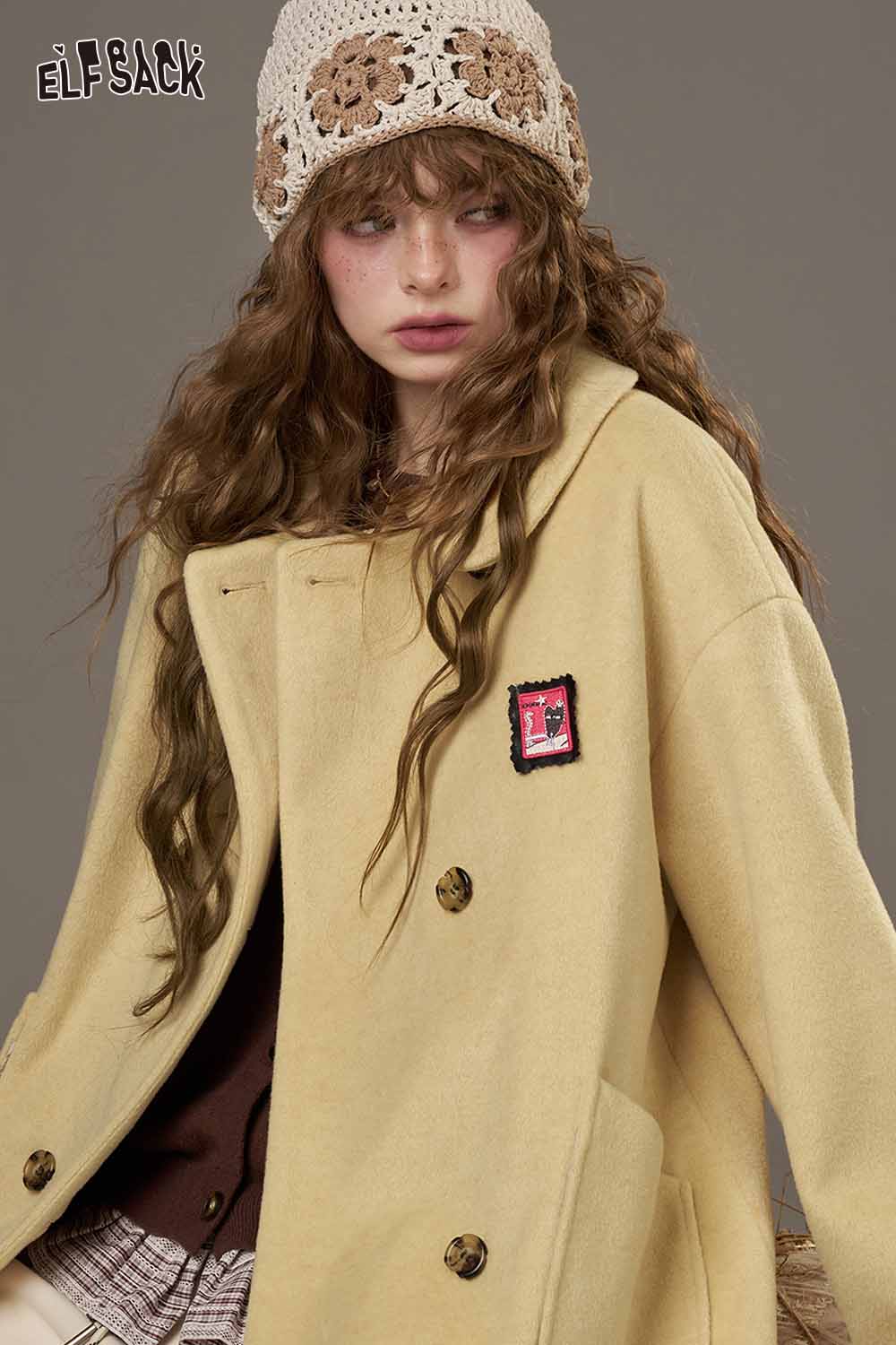 Women in a stylish ELFSACK wool coat showing a trendy design, featuring a women's patterned collared coat