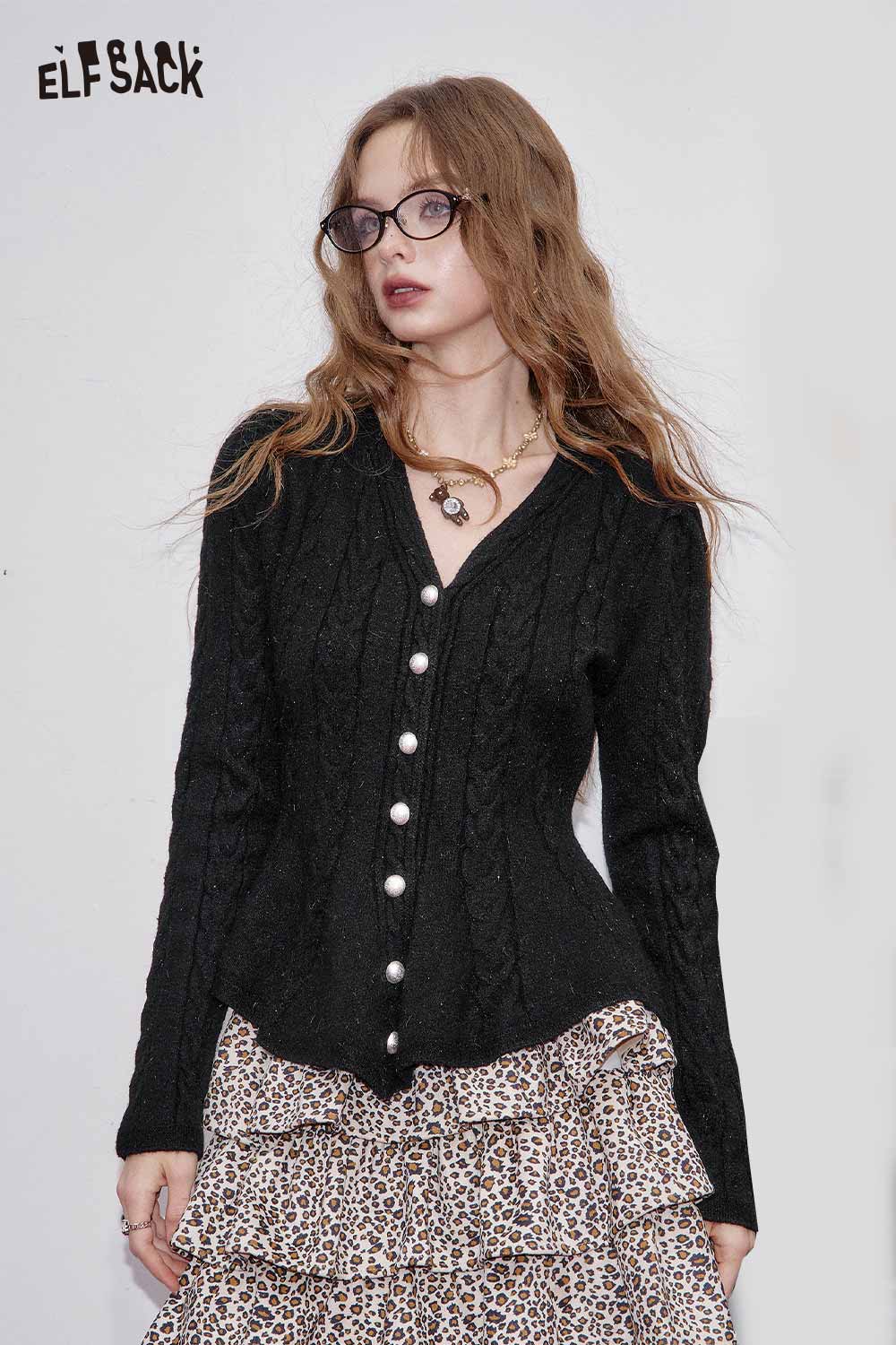 ELFSACK women's peplum knit sweater in black with cable knit design and pearl buttons