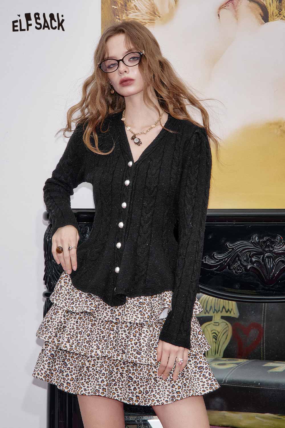 ELFSACK women's peplum knit sweater in black with a cable knit design and buttons