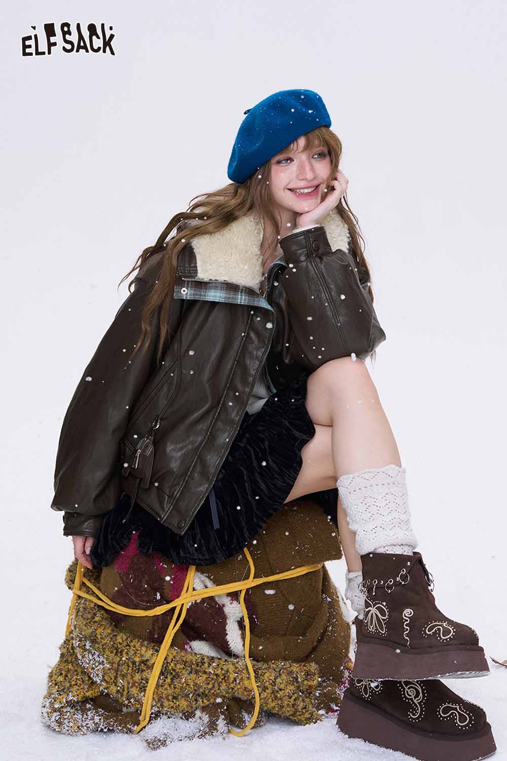 ELFSACK women's plaid leather jacket styled with cozy winter accessories and a cheerful expression