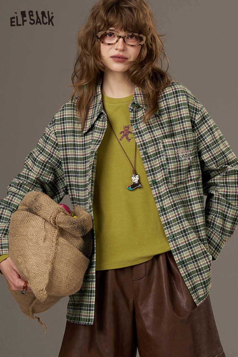 ELFSACK women's plaid shirt with back print styled with a green sweater and brown pants