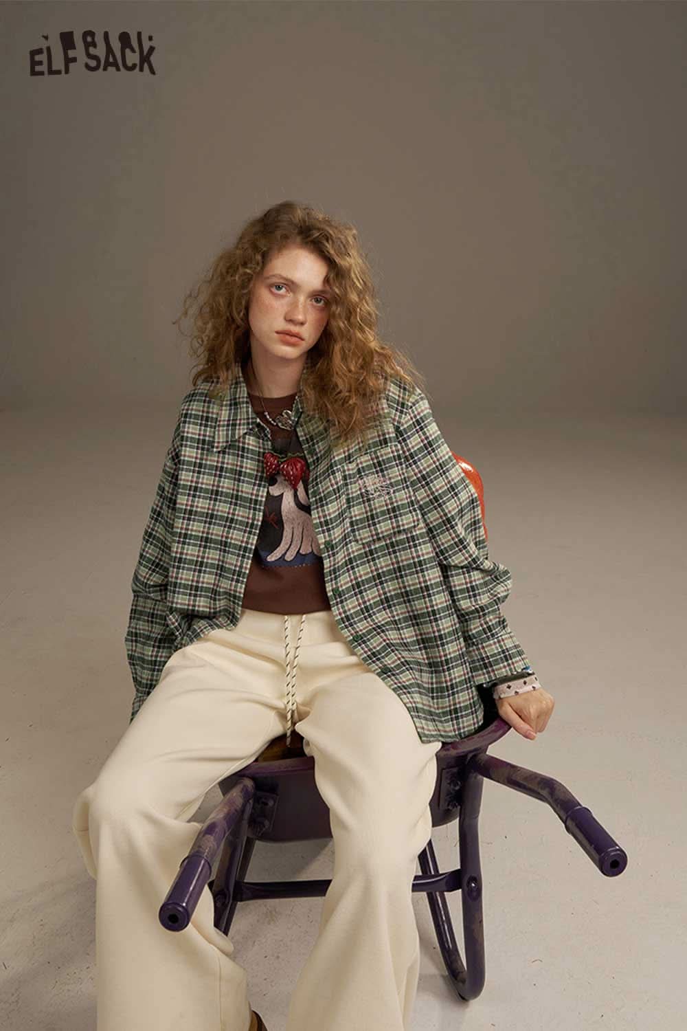 ELFSACK women's plaid shirt with back print styled over a graphic tee and relaxed pants