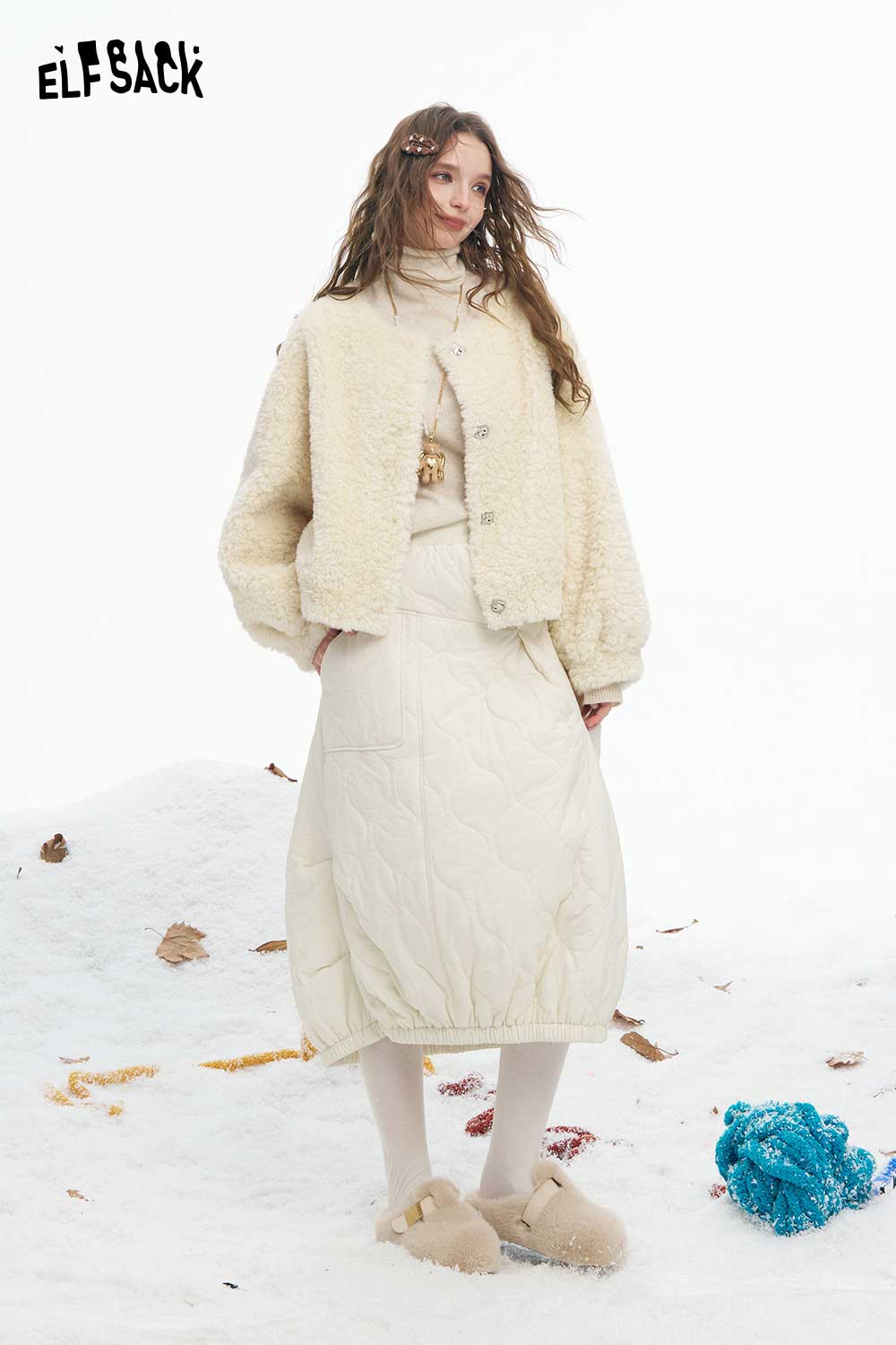 ELFSACK women's plush short coat in cream color, styled with a quilted skirt and cozy accessories