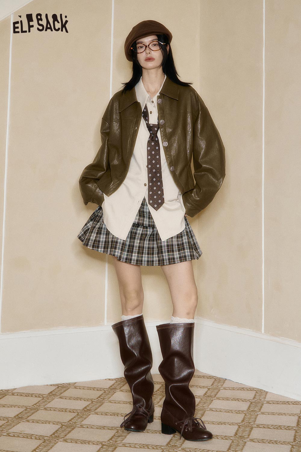 ELFSACK women's PU cropped moto jacket in olive green, styled with a plaid skirt and accessories