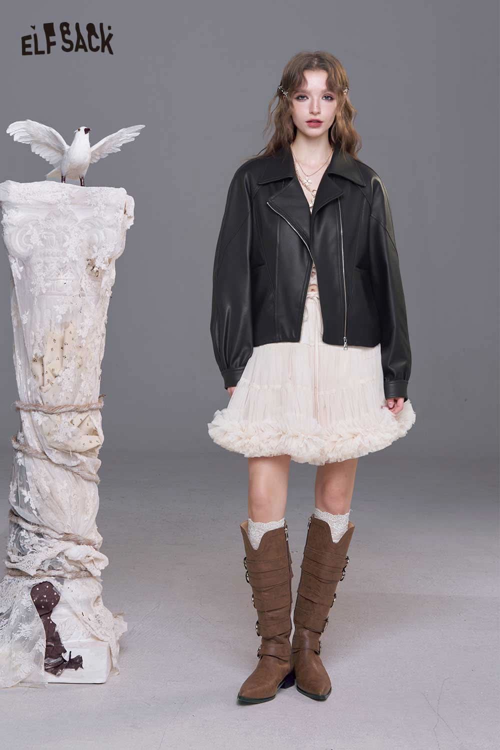Women's PU motorcycle jacket by ELFSACK styled over a cream ruffled dress, perfect for chic outfits