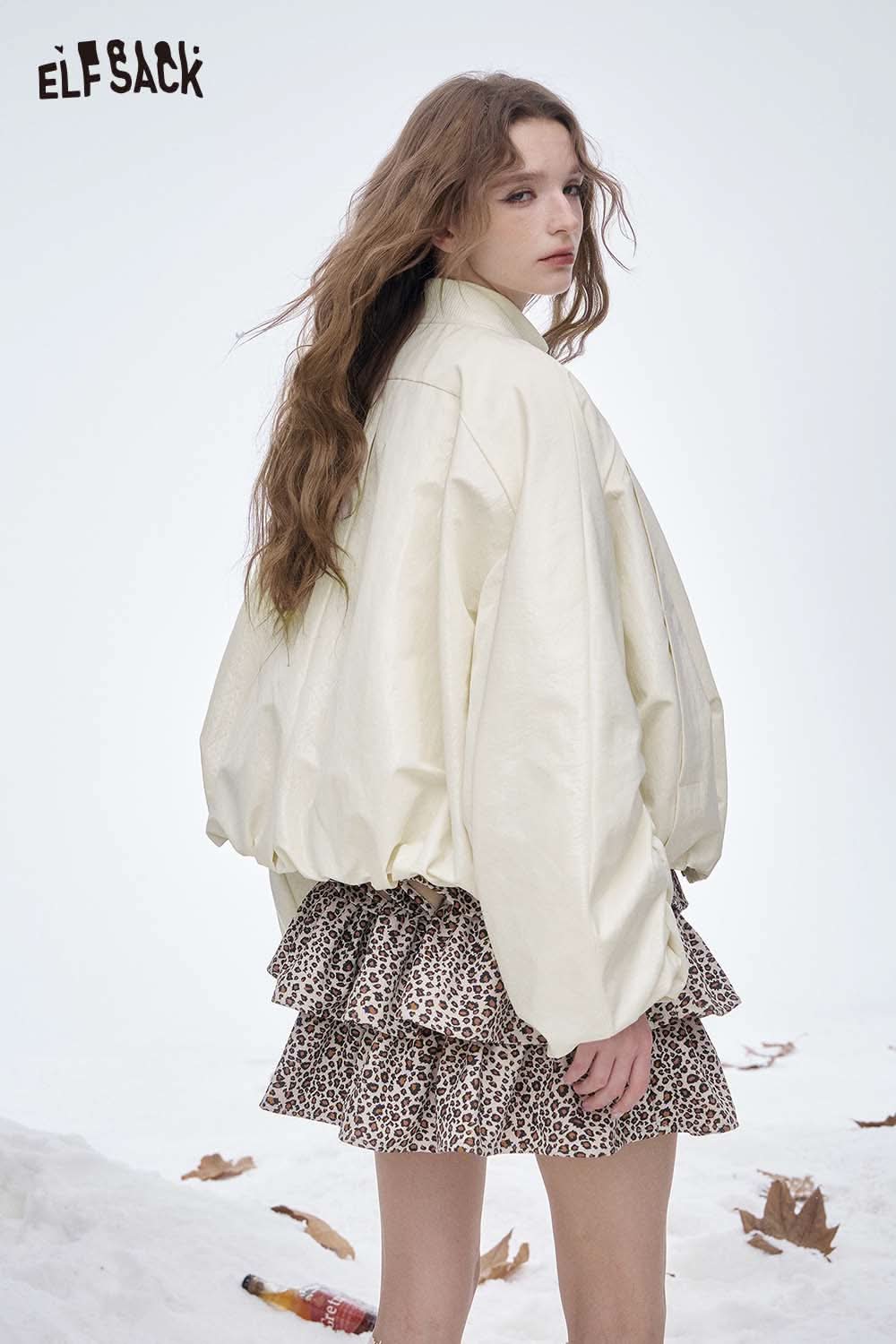 ELFSACK women's puff sleeve down jacket in cream color worn over a leopard print dress