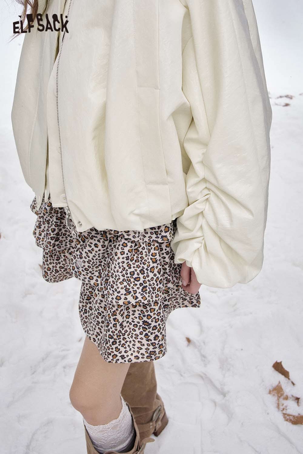 Stylish women's puff sleeve down jacket in cream paired with a leopard print skirt