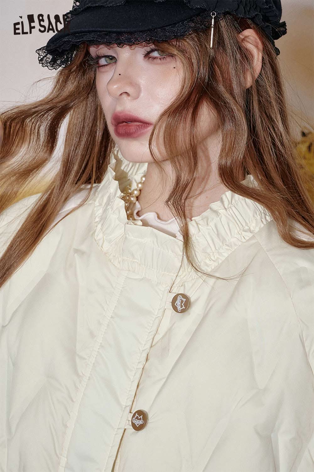 ELFSACK women's quilted puffer jacket in cream color featuring a ruffled collar and button details