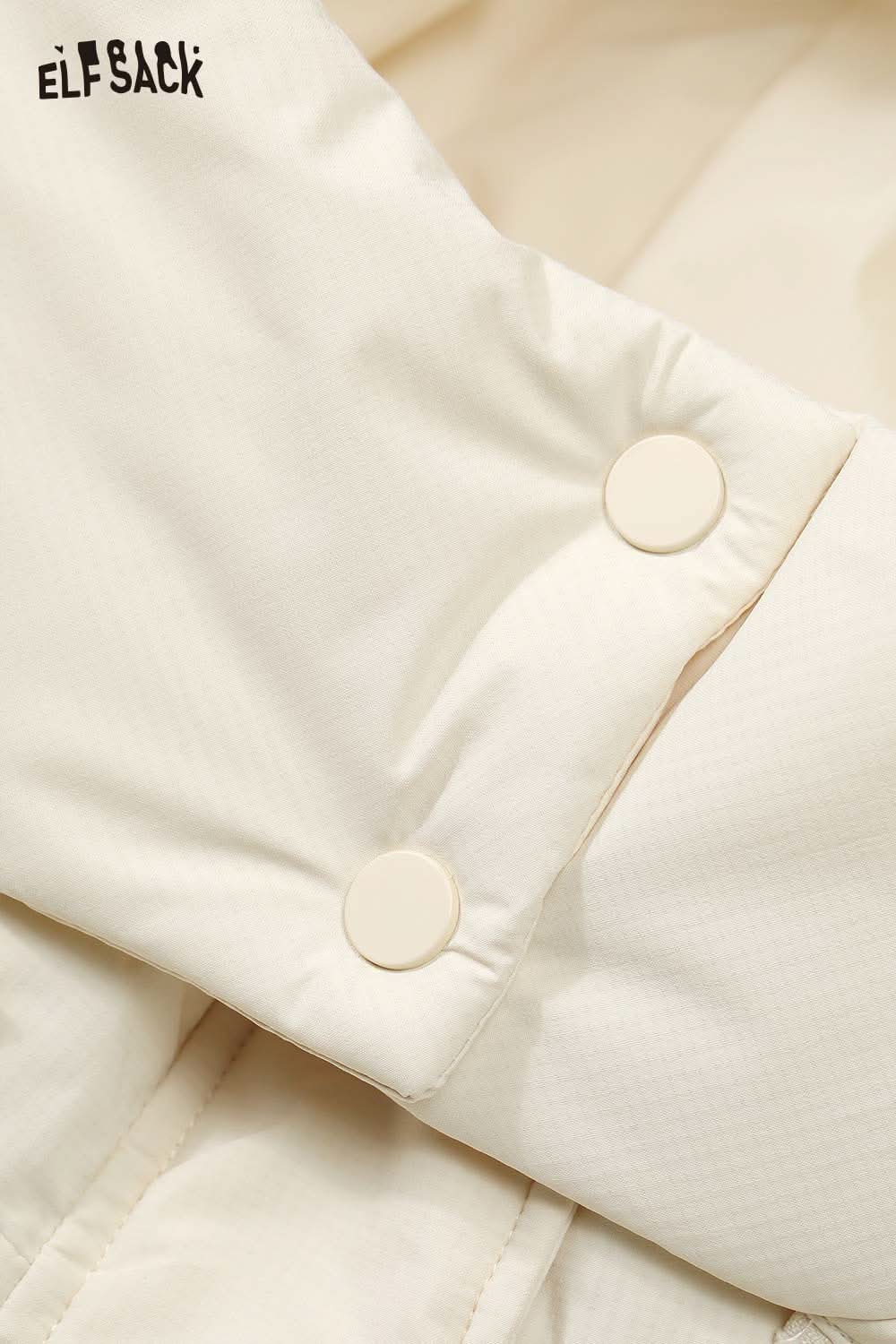 Close-up of ELFSACK women's quilted puffer jacket sleeve with snap buttons and soft fabric texture