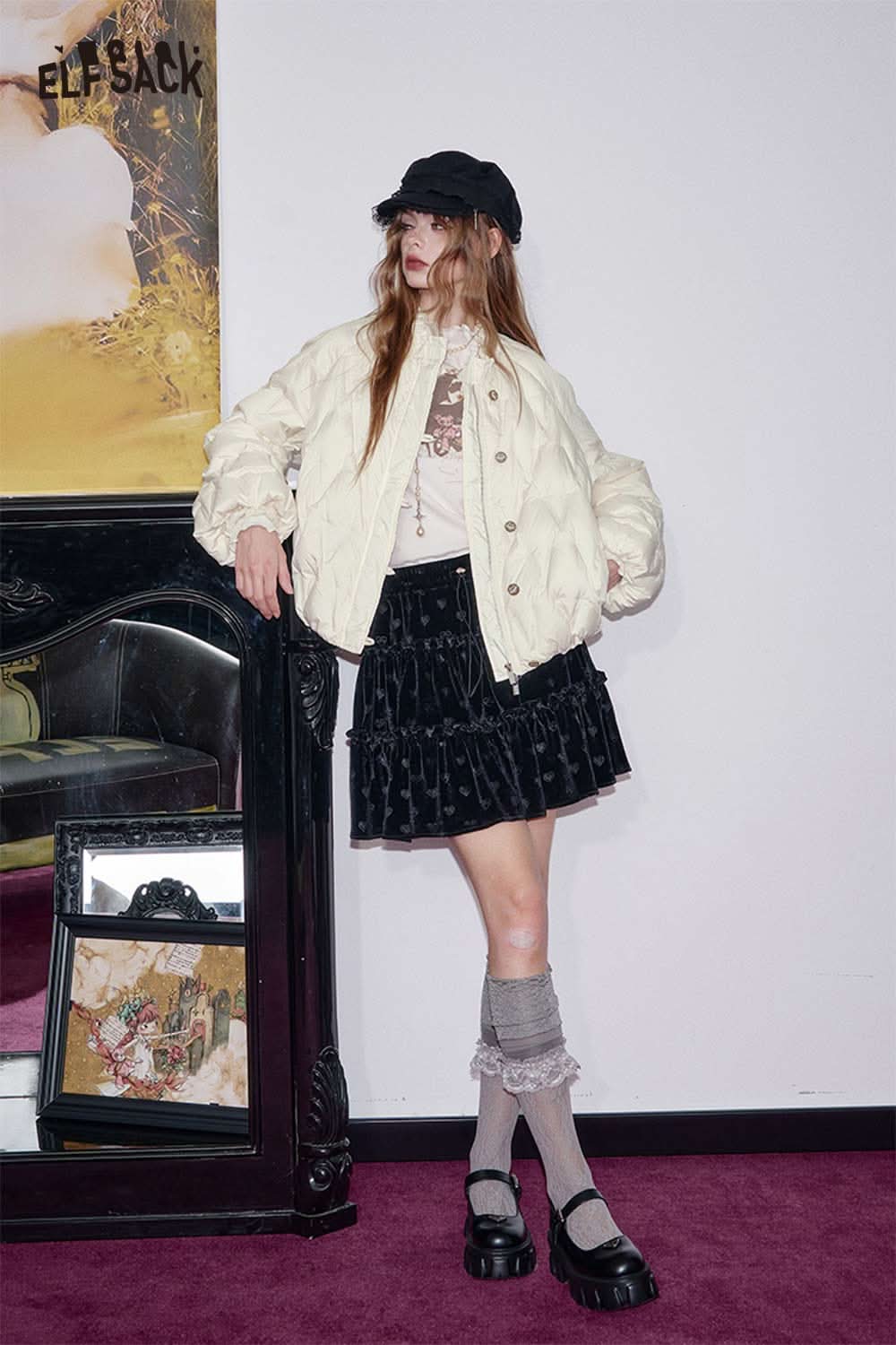 ELFSACK women's quilted puffer jacket in cream color, styled with a black skirt and accessories