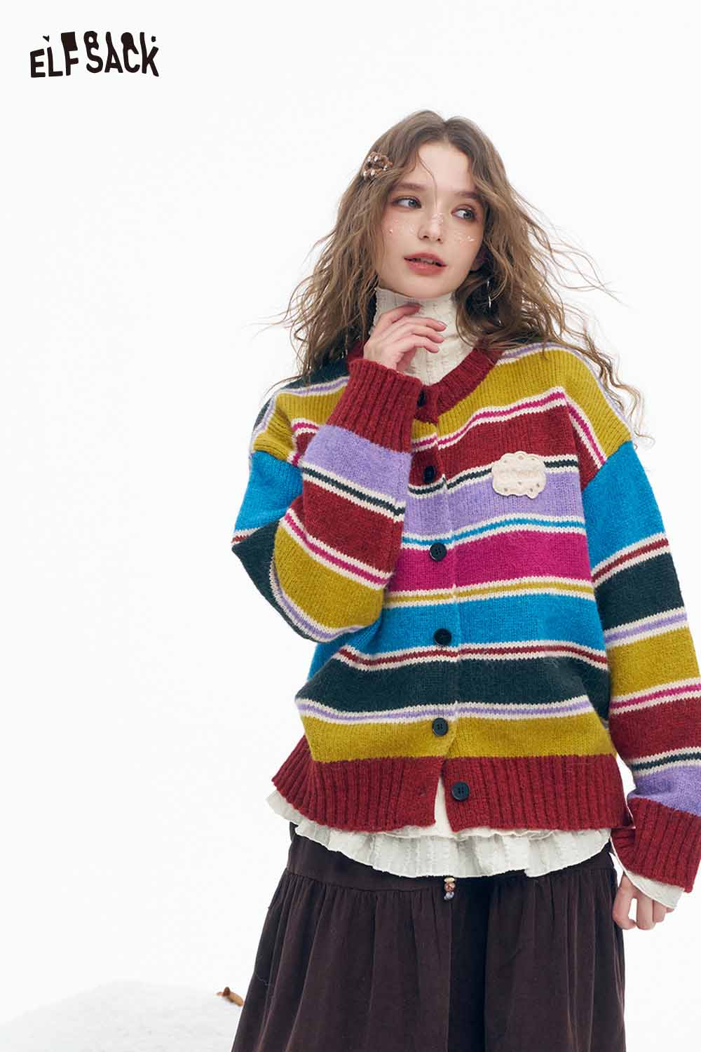 ELFSACK women's ruffle high neck t-shirt layered under a colorful striped cardigan