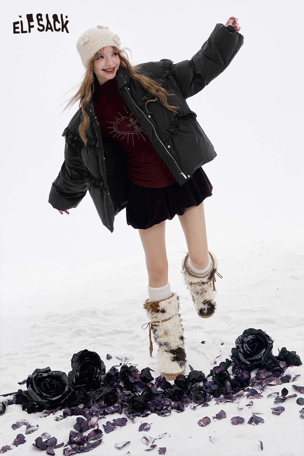 Women modeling ELFSACK women's ruffle puffer down jacket in a winter scene with stylish accessories