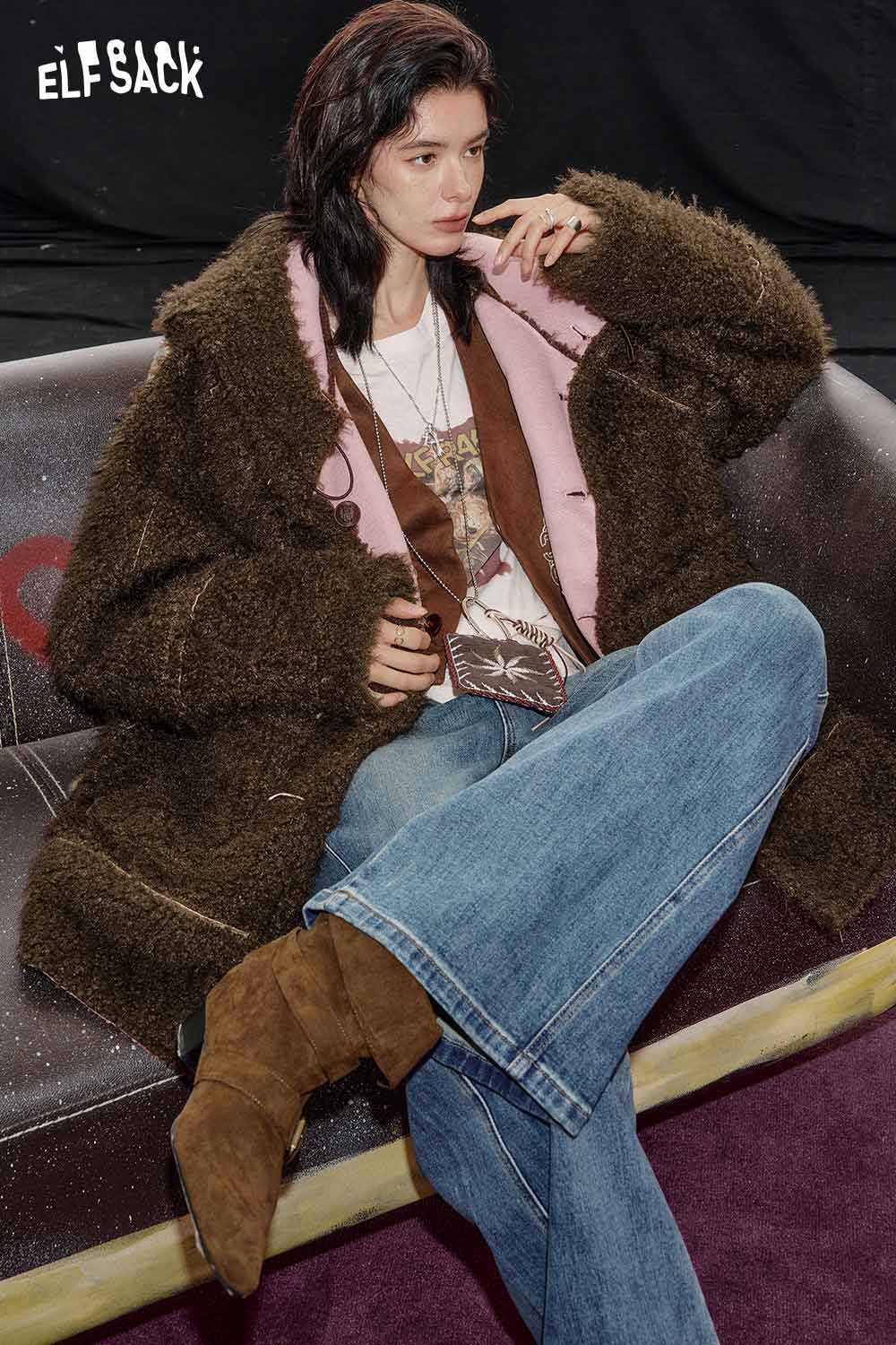 ELFSACK women's sherpa lined long coat in brown, stylishly worn over a graphic tee with wide-leg jeans