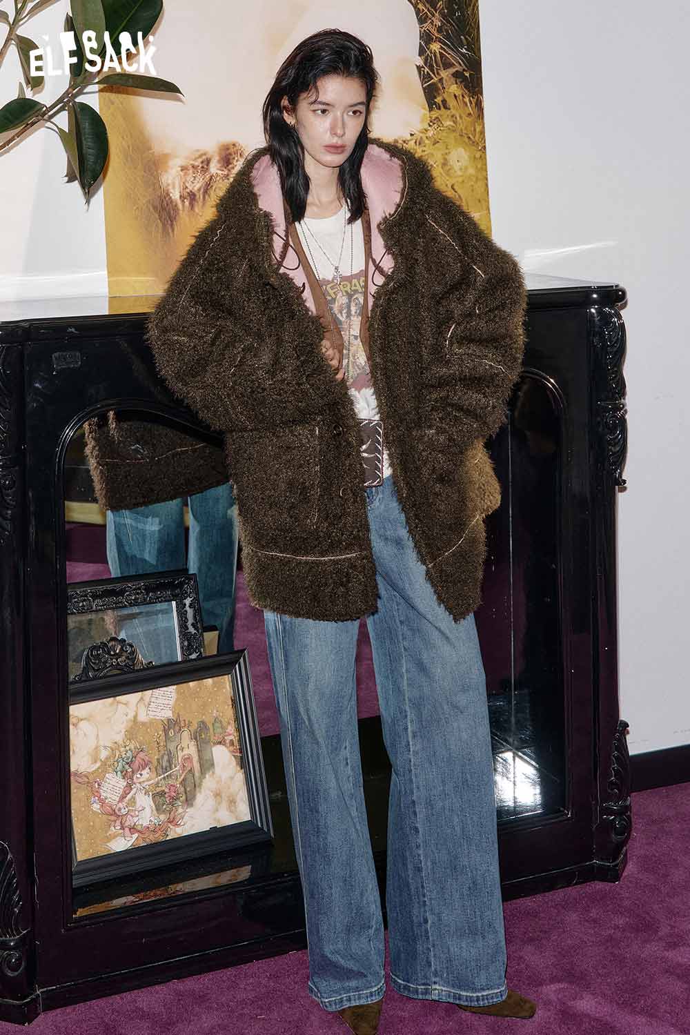 ELFSACK women's sherpa lined long coat in brown with a relaxed fit, styled over a graphic tee and wide-leg jeans