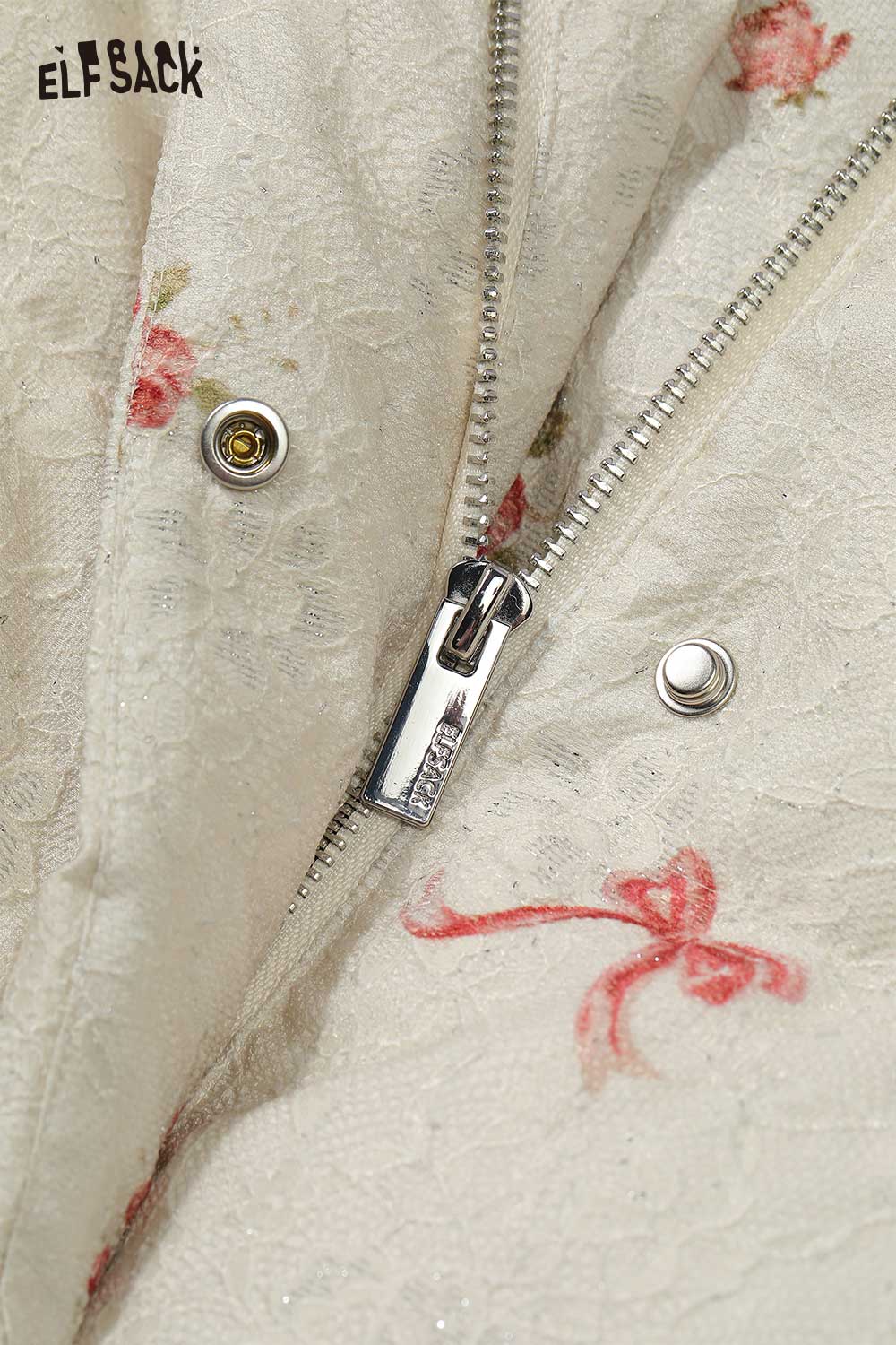 Close-up of ELFSACK women's short down jacket with floral pattern and zipper details