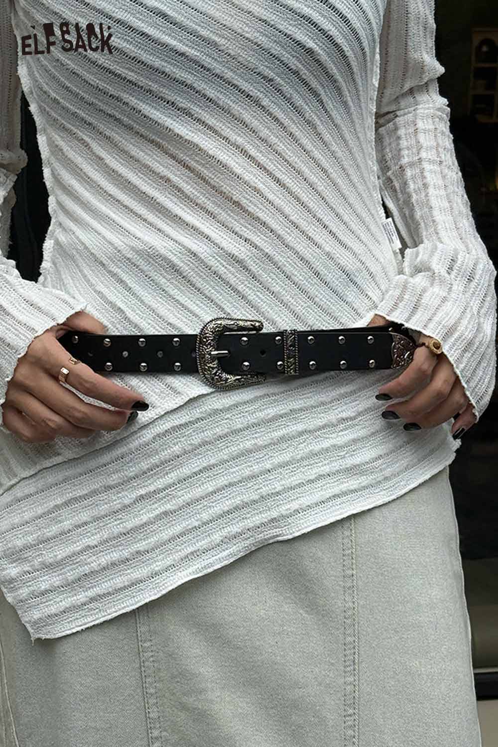 Stylish women's silver rivet thin belt with a decorative buckle, worn with a chic top