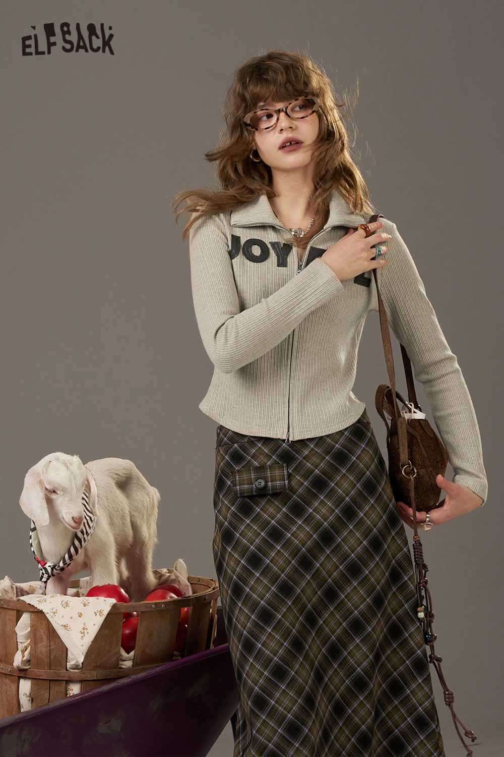 ELFSACK women's slimming zip up shirt in gray, styled with a plaid skirt and accessories
