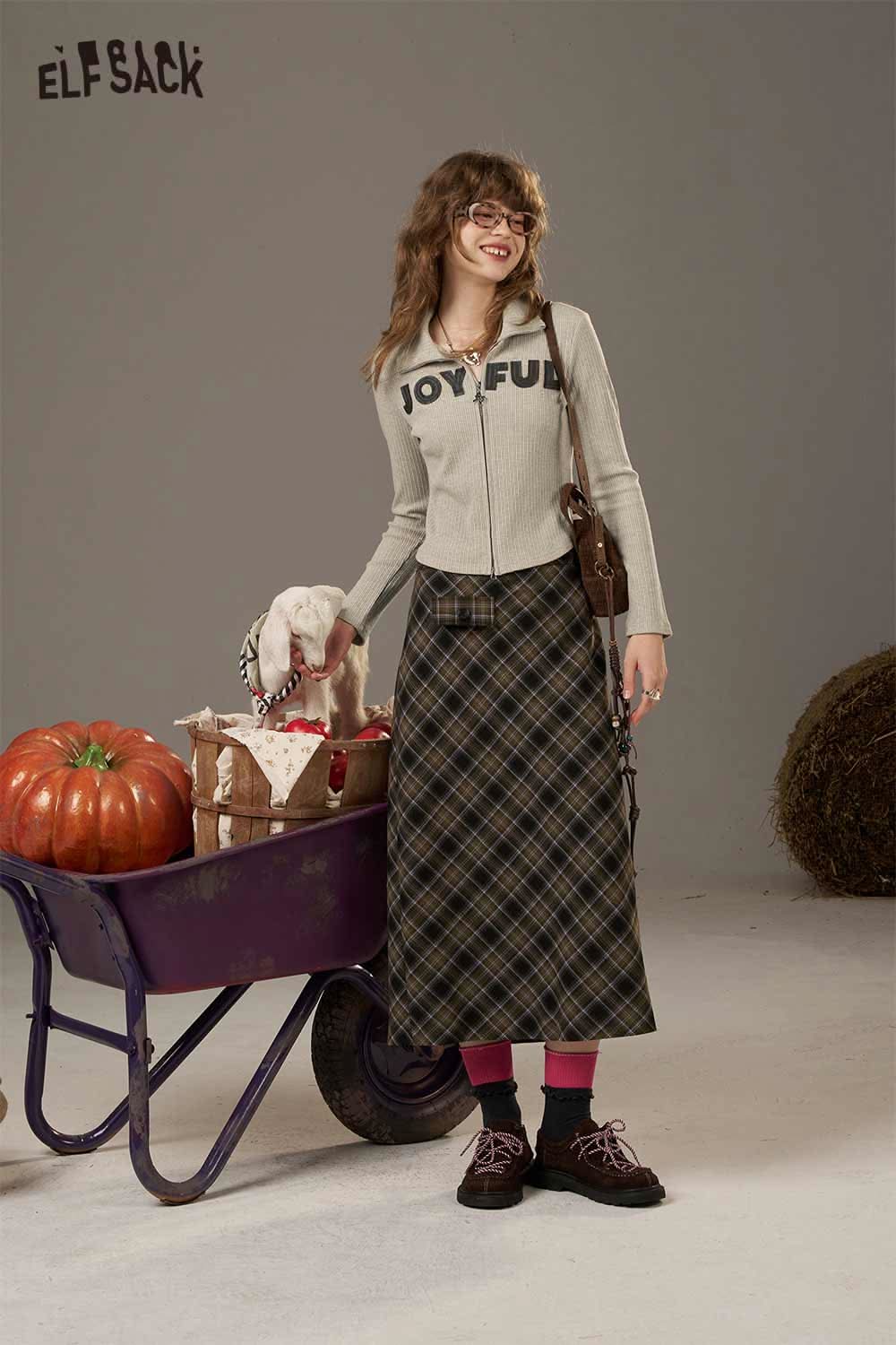 ELFSACK women's slimming zip up shirt in light grey with joyful text, paired with a stylish plaid skirt
