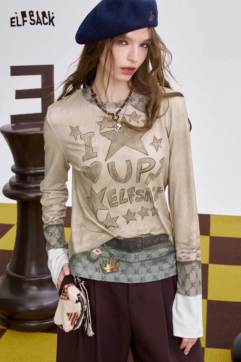 ELFSACK women's soft graphic long sleeve t-shirt with star and heart design, perfect for casual wear