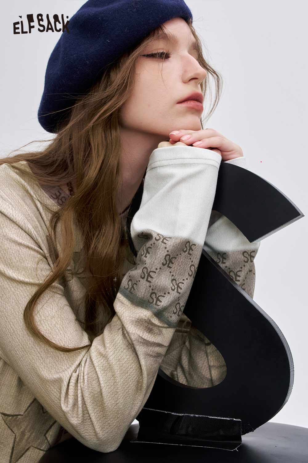 ELFSACK women's soft graphic long sleeve t-shirt with unique design for casual style