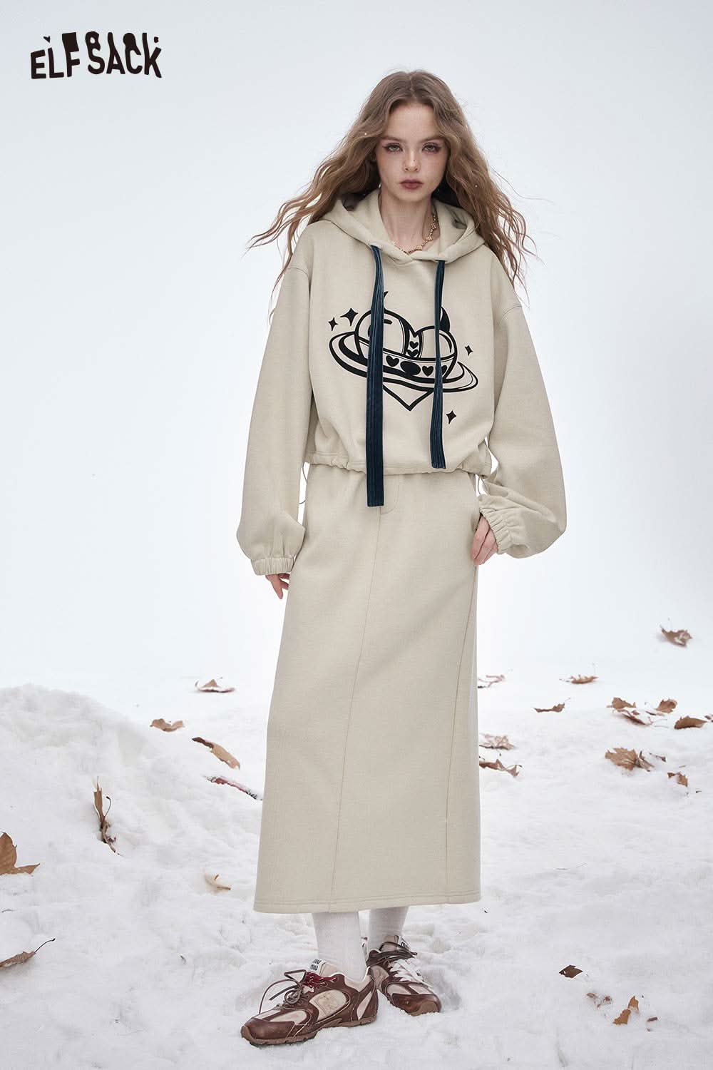 ELFSACK women's soft heart graphic skirt set featuring a cozy hoodie and long skirt on a winter background