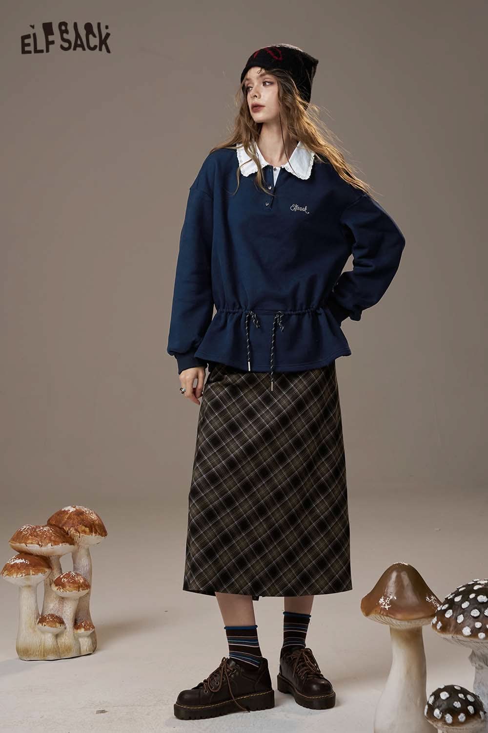 ELFSACK women's soft pullover top with puffed hem and embroidered detail, styled with a plaid skirt