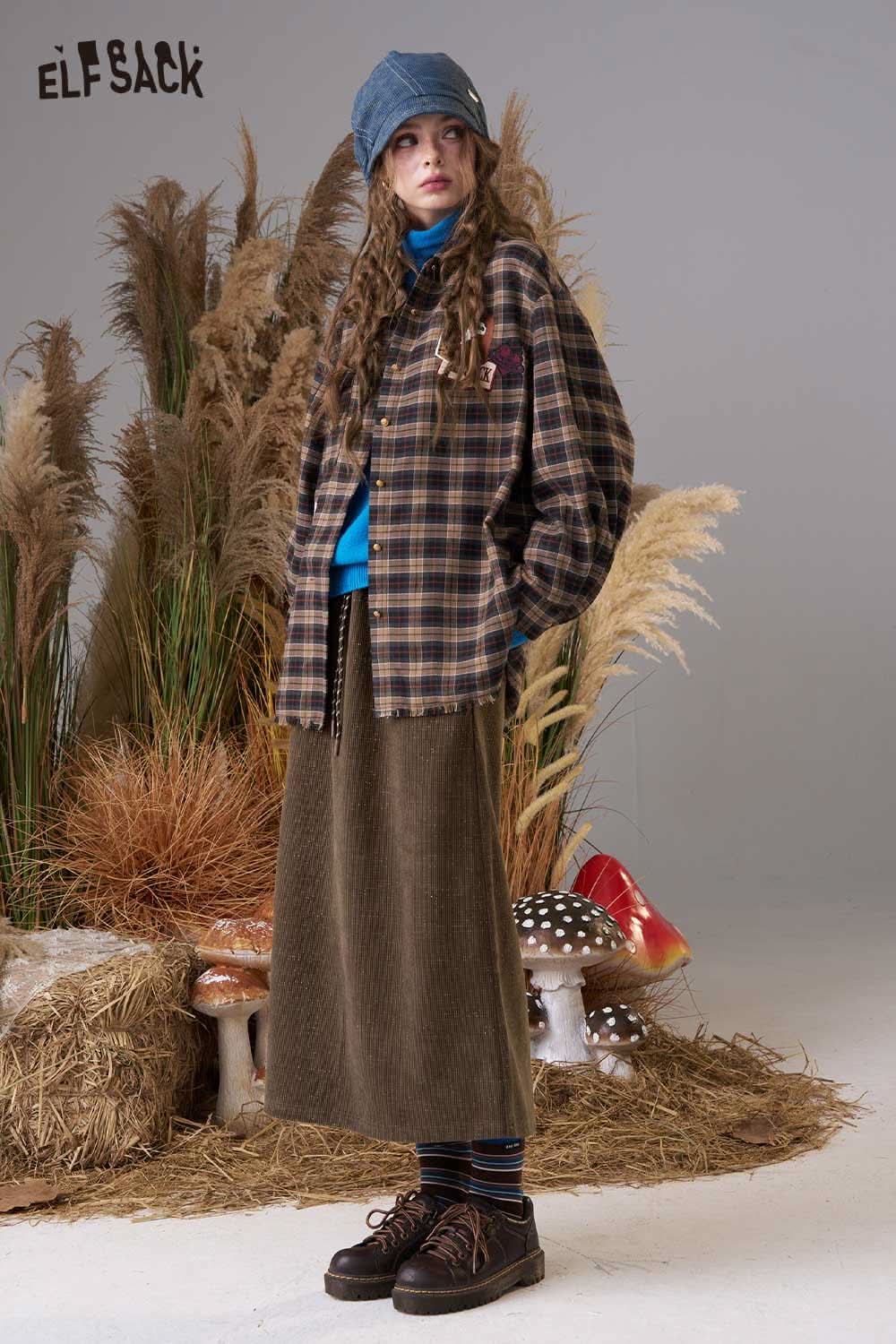 ELFSACK women's soft textured midi skirt styled with a plaid shirt and beanie for a cozy look