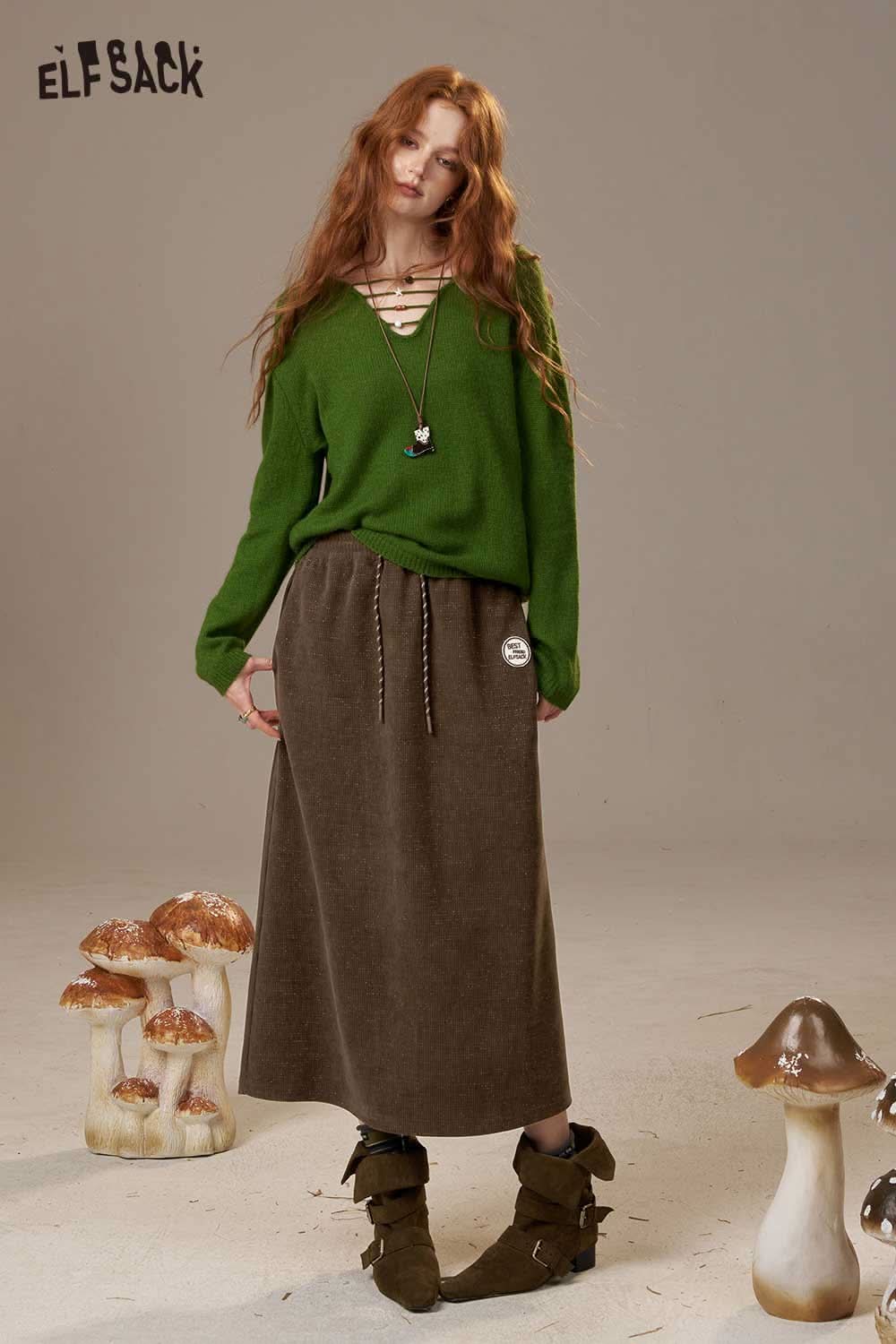 ELFSACK women's soft textured midi skirt in brown, paired with a green sweater for a stylish autumn look