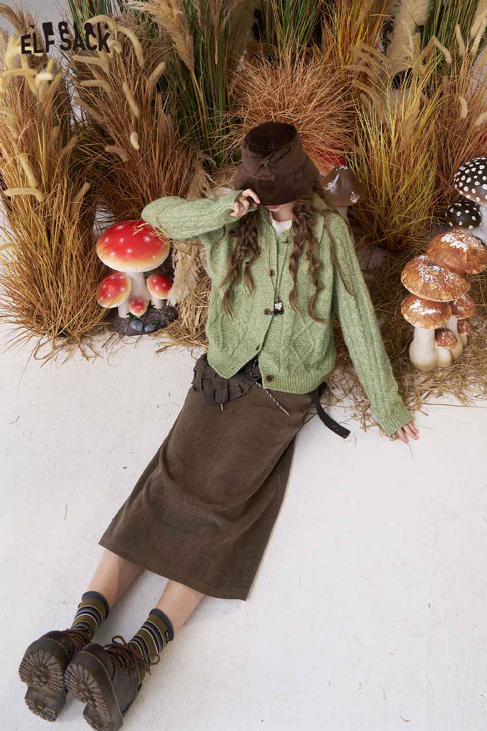 ELFSACK women's soft textured midi skirt styled with a cozy green cardigan and playful accessories